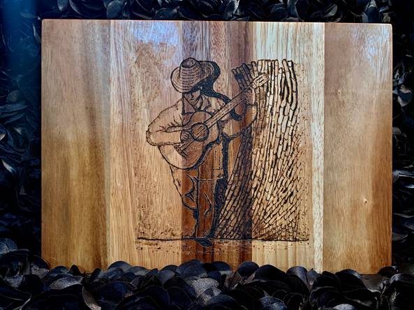 “Mexican Guitar Player” wood burned, by Lindsey Bustos Rodriguez at SCC Belmont